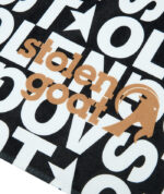 Close up of gold SG logo on Legacy beach towel
