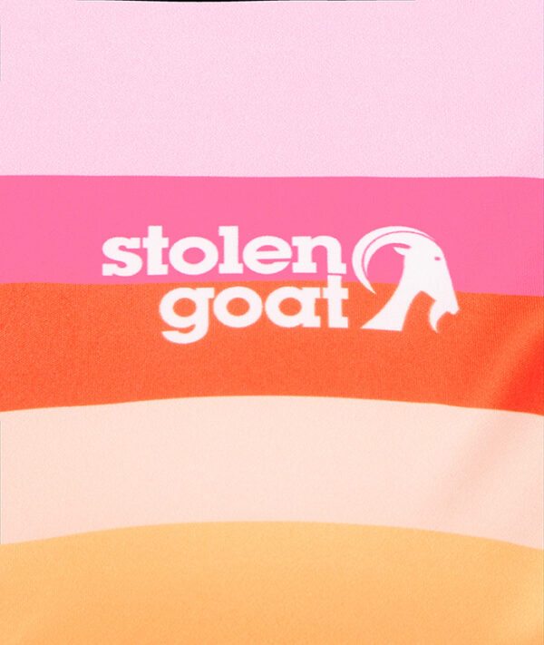 Close up of white Stolen Goat logo on front of women's Arcadia ibex gilet