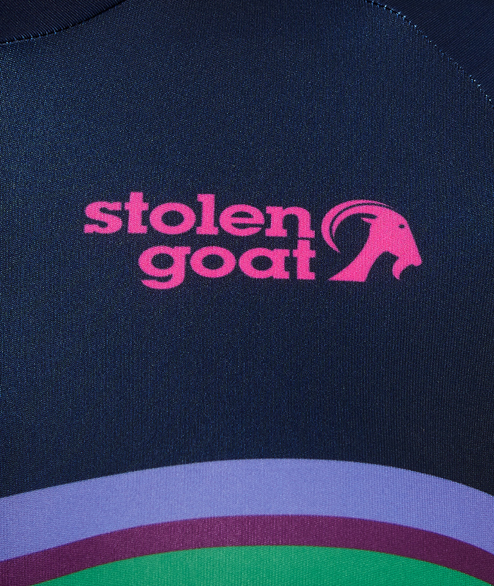Close up of pink stolen goat logo on the front of the women's Blast jersey