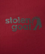 Close up of Stolen Goat logo on women's maroon gravel jersey