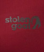 Close up of Stolen Goat logo on women's maroon gravel jersey