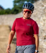 Woman wearing maroon gravel jersey
